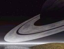 Saturno y sus lunas incrustadas en él